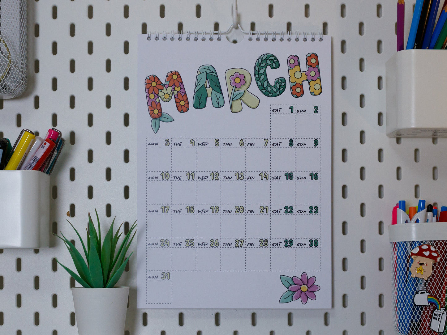 2025 Colourful Wall Calendar hanging on office peg board - March with Flower Design