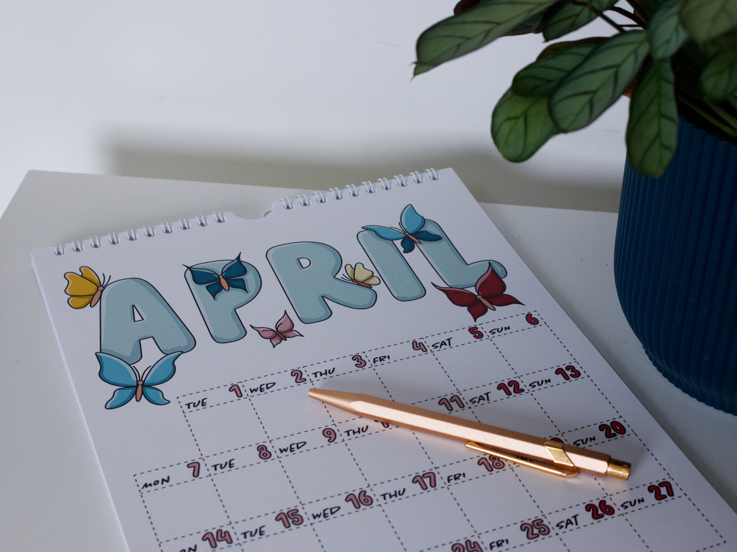 2025 Colourful Wall Calendar laying flat - April with Butterfly Design