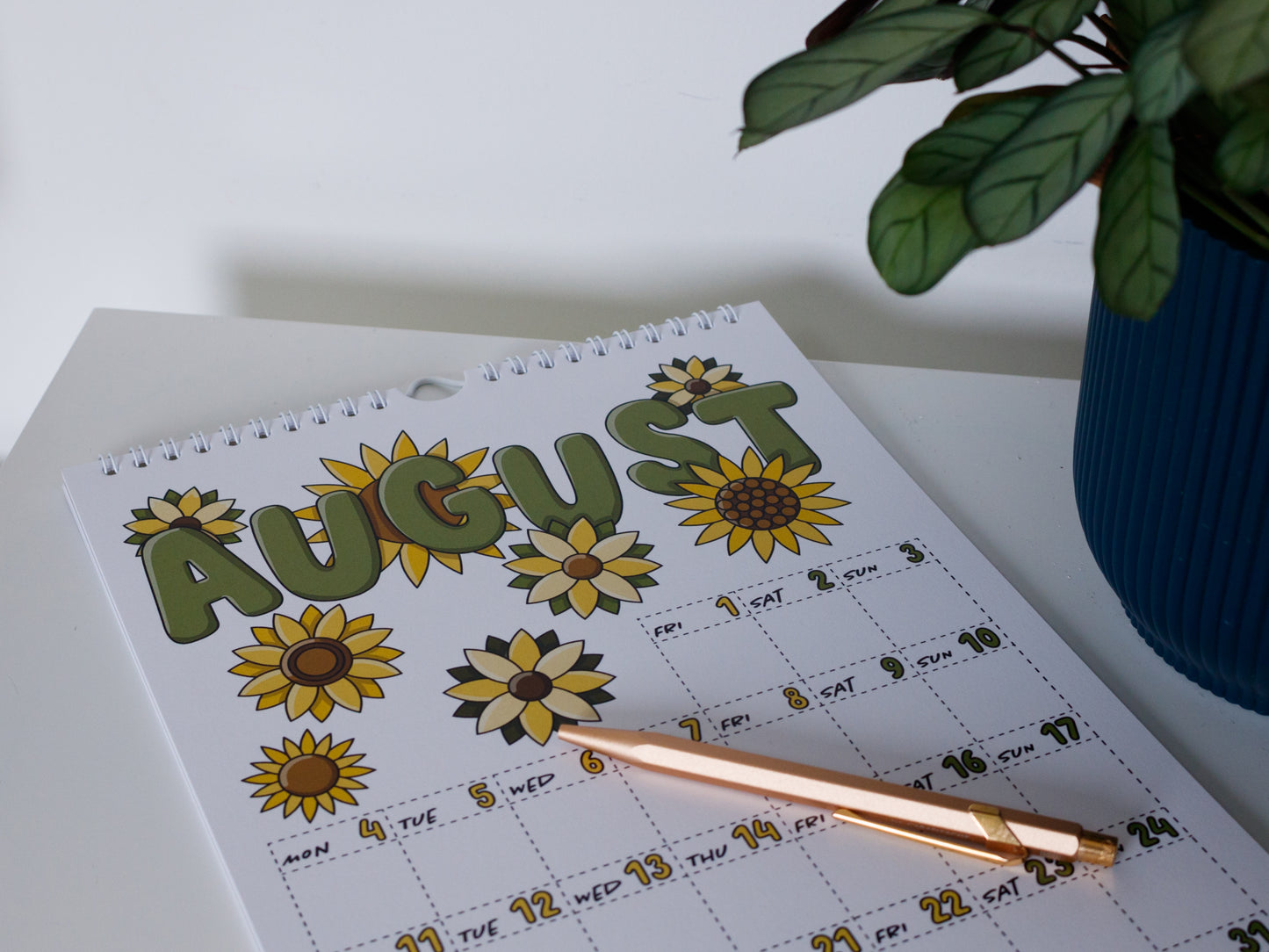2025 Colourful Wall Calendar laying flat - August with Sunflower Design