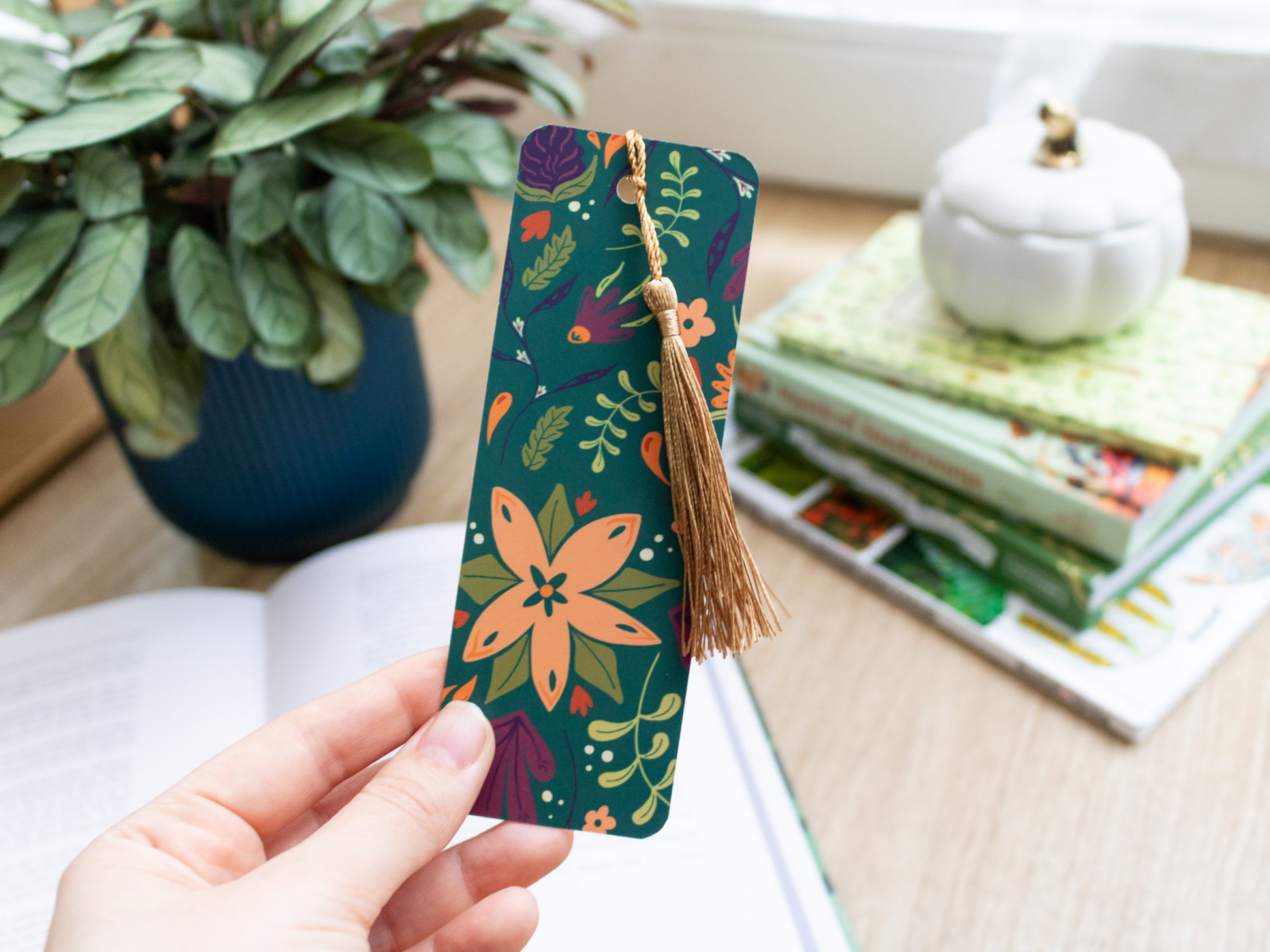 Autumnal Flower Bookmark with gold Tassel - held in hand