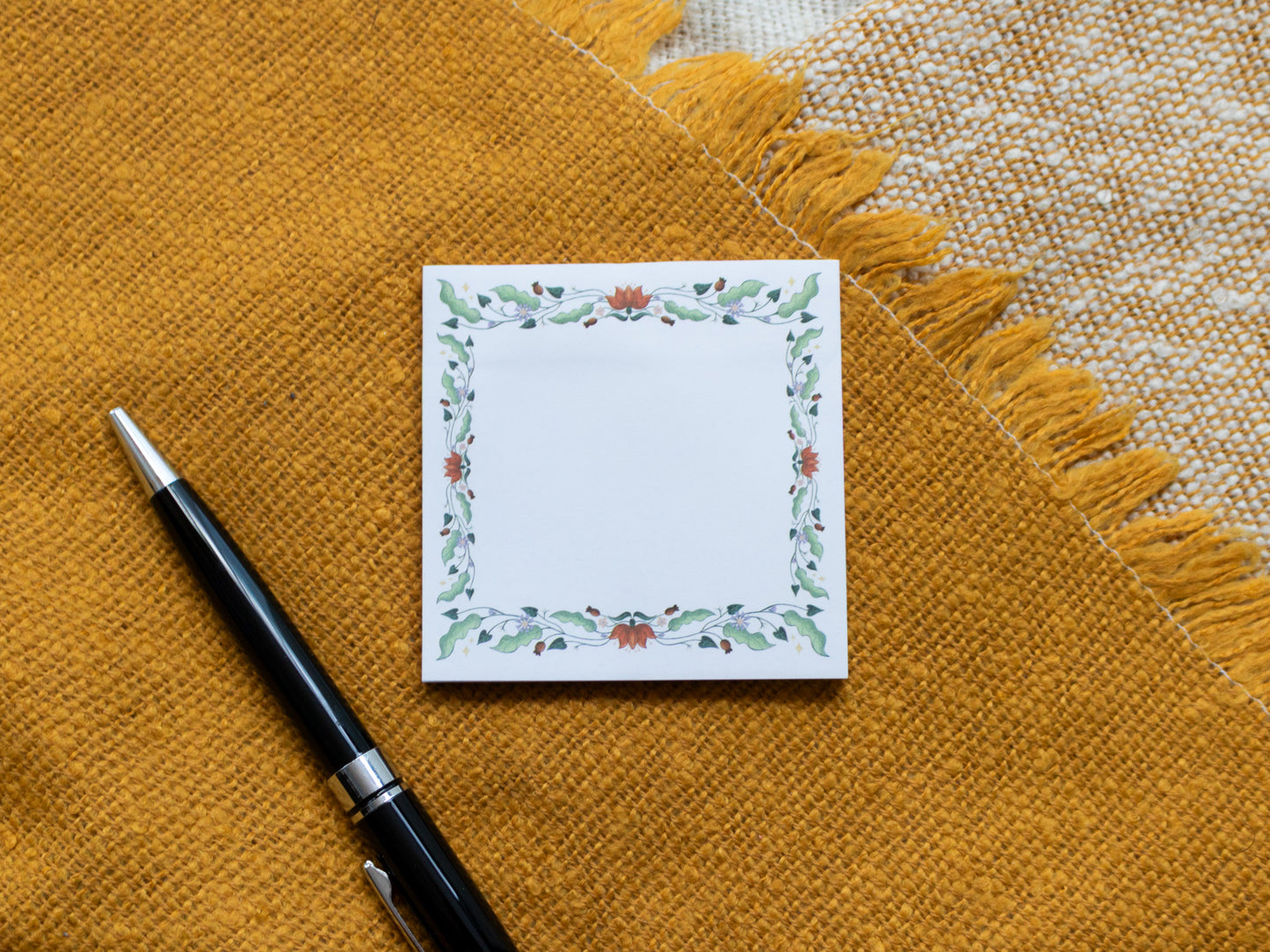 Floral Pattern Sticky Notes next to pen
