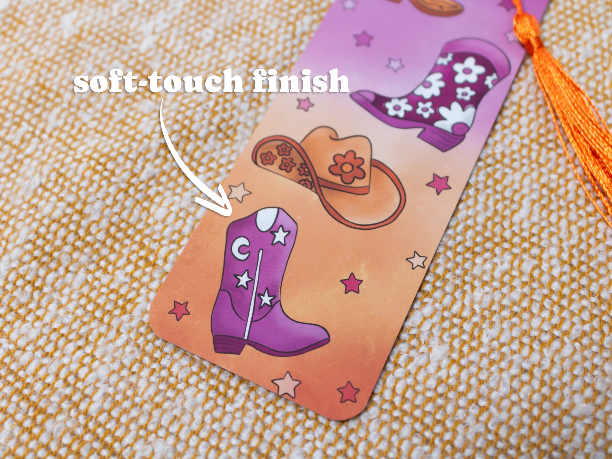 Cowgirl / Cowboy / Cowthey Bookmark with Tassel - close up - TEXT OVERLAY: soft-touch finish