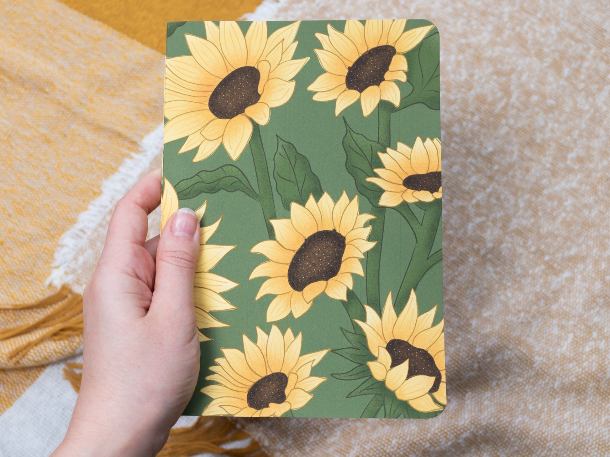 A5 Handmade Notebook with Sunflower Design - held in hand