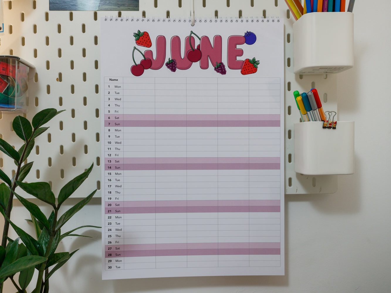 2026 A3 Family Planner: June page on a wall with stationery items