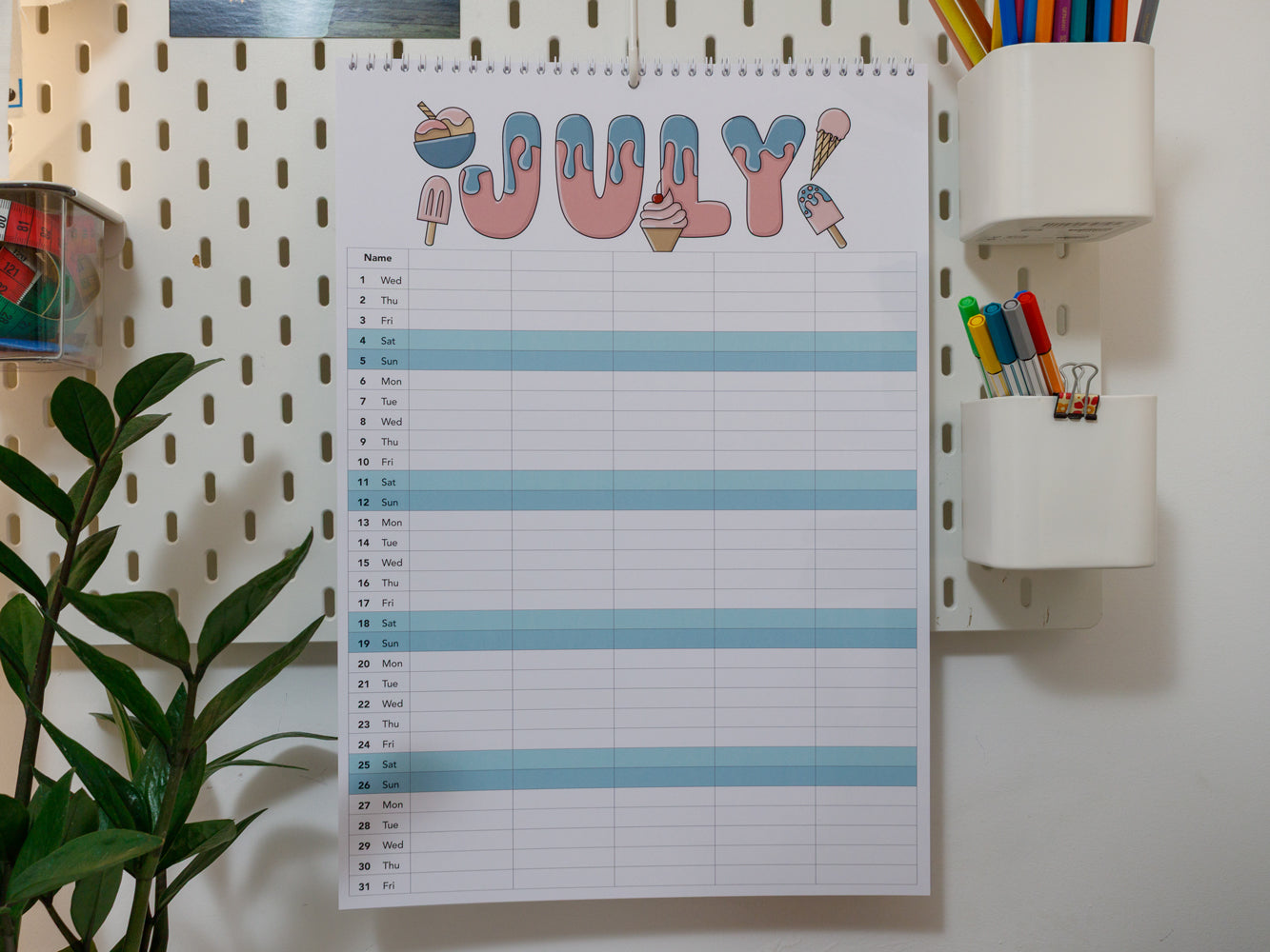 2026 A3 Family Planner: July page on a wall with stationery items