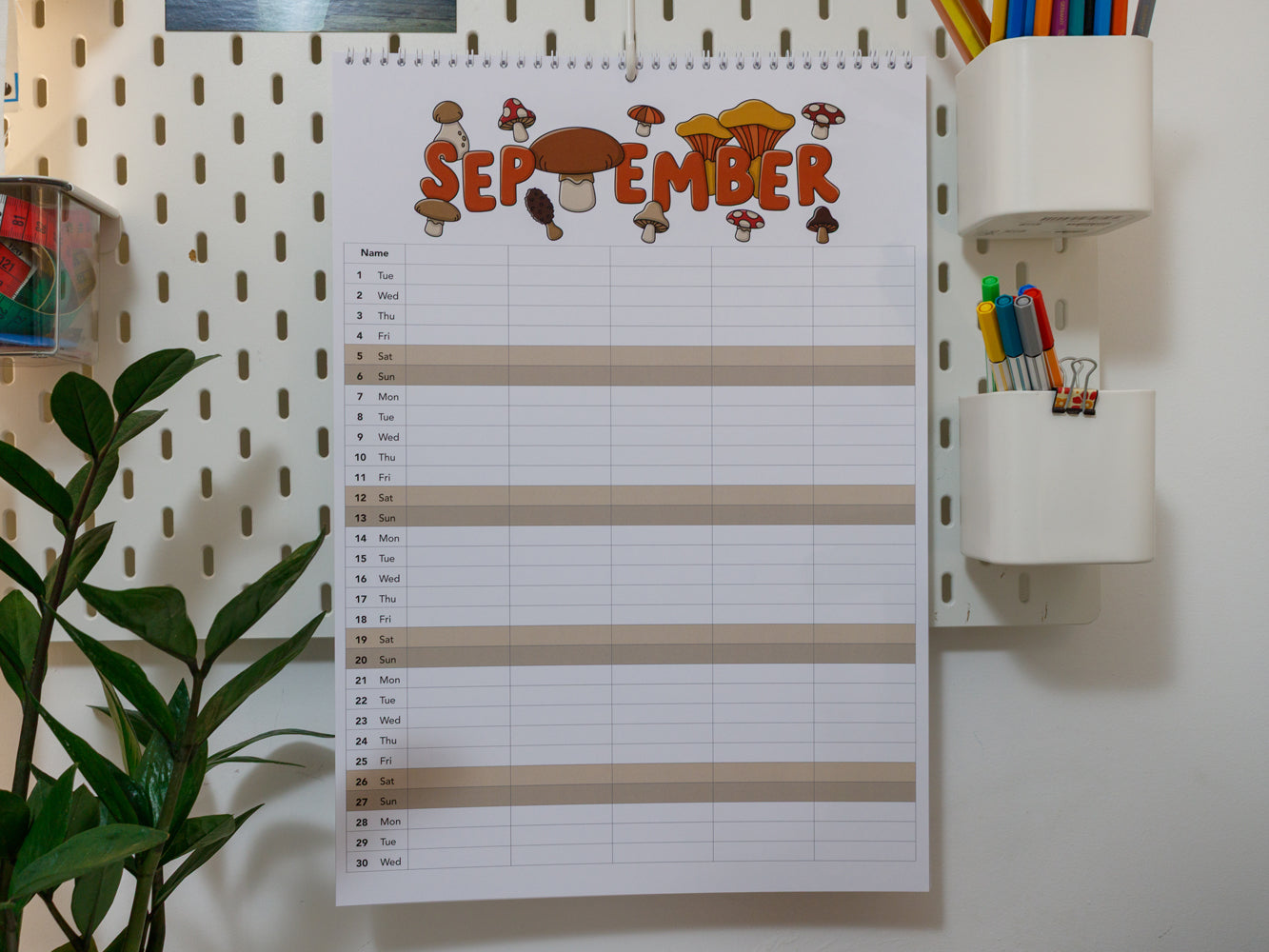 2026 A3 Family Planner: September page on a wall with stationery items