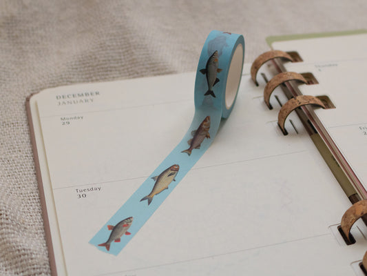 Washi tape with fish design on a planner