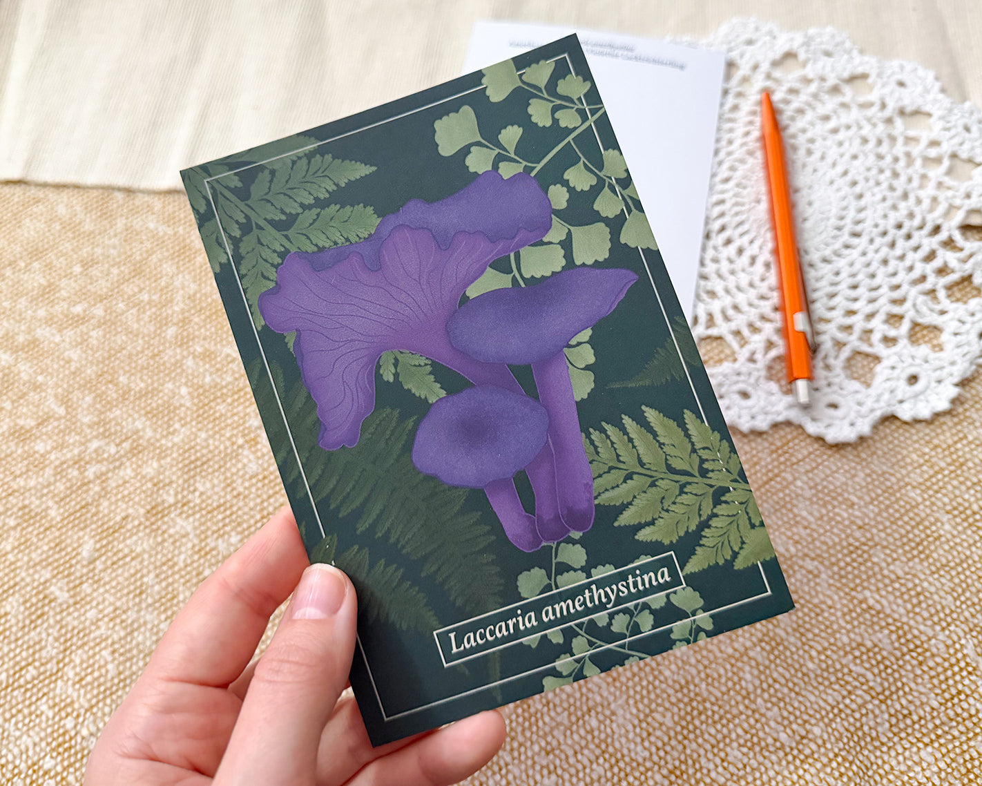 Amethyst Deceiver Mushroom Post Card - held in hand