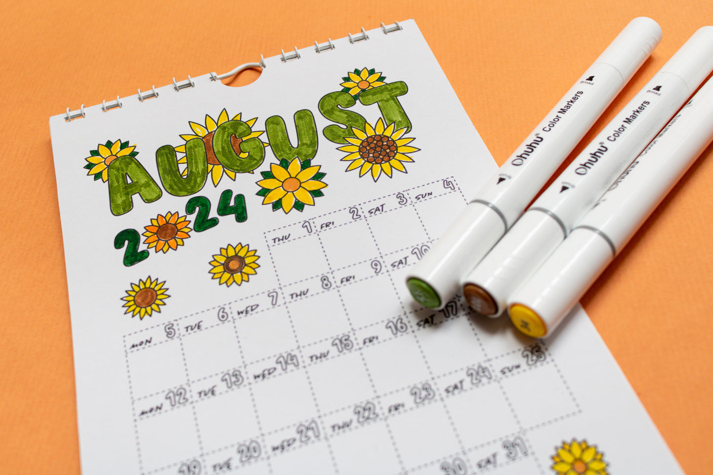 2024 Colouring Wall Calendar by Mellow Apricot Studio - August page coloured in with markers