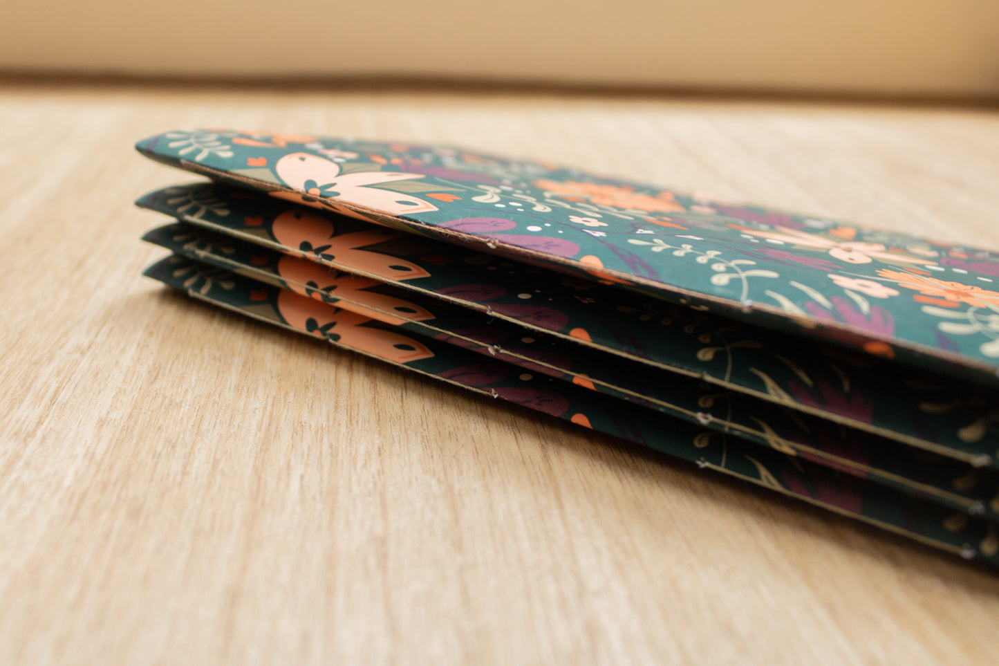 Handmade A5 notebook with autumnal floral design by MellowApricotStudio & KreativWerkstatt24 - side view of stitches
