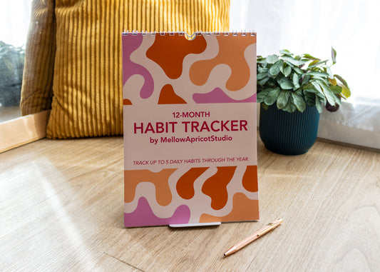 12-Month Moderns Habit Tracker by MellowApricotStudio - cover page in lifestyle setting