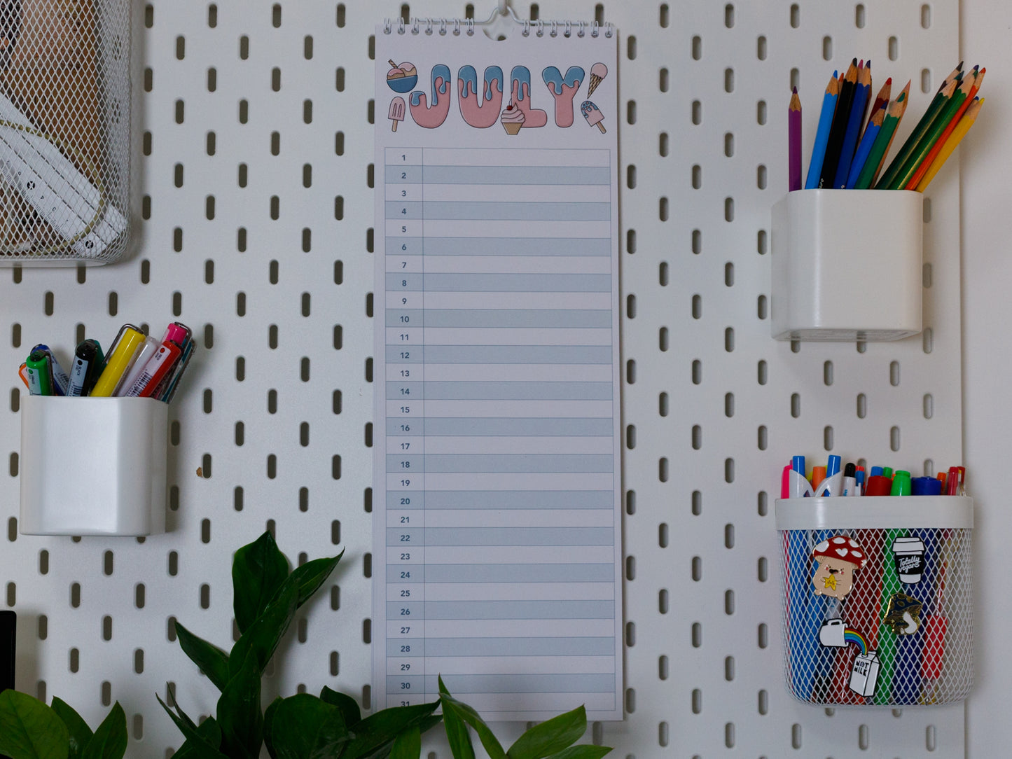 Colourful Perpetual Birthday & Anniversary Planner hanging on office peg board - July with Ice Cream Design