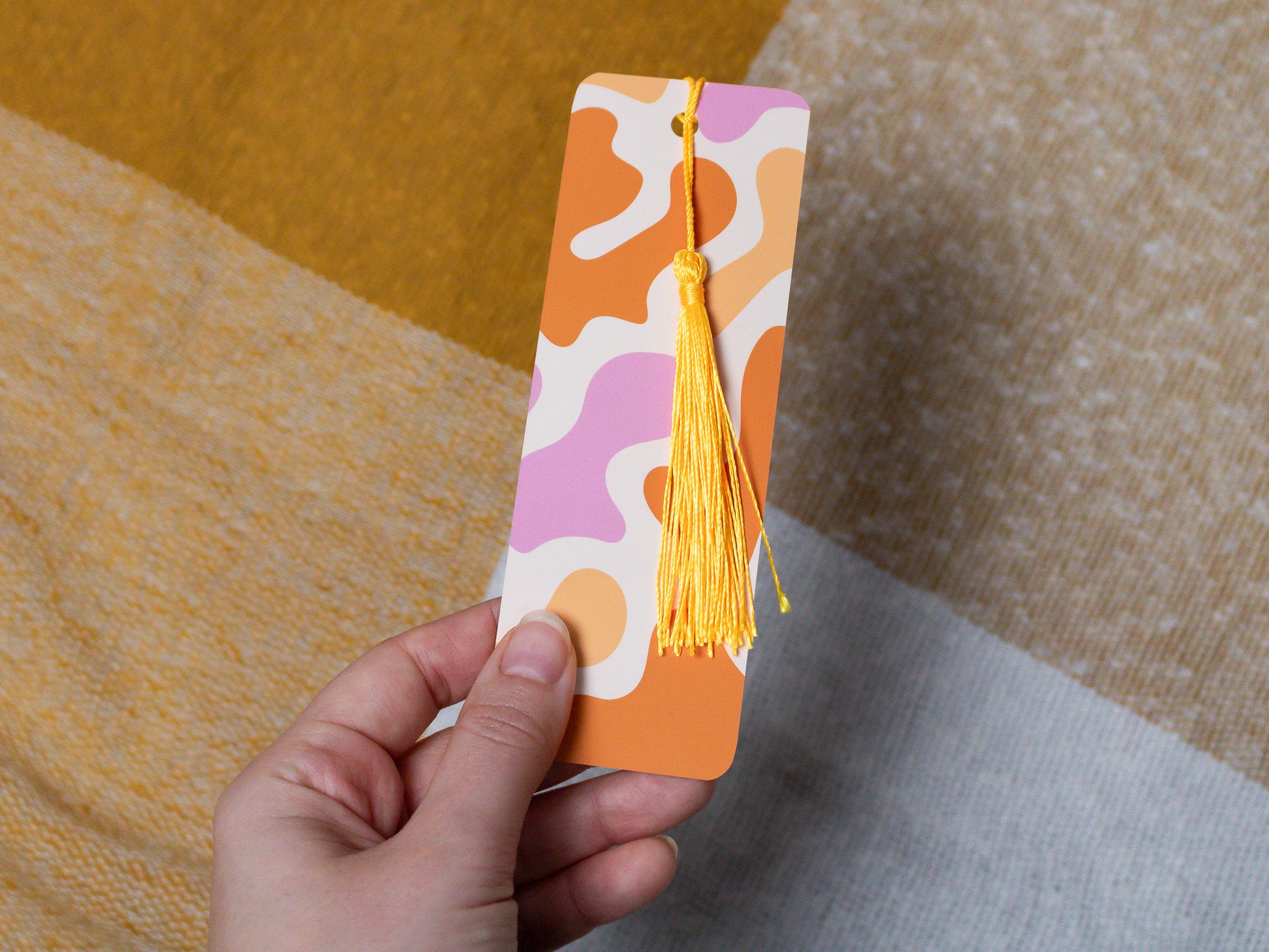 Abstract Bookmark with Tassel - held in hand