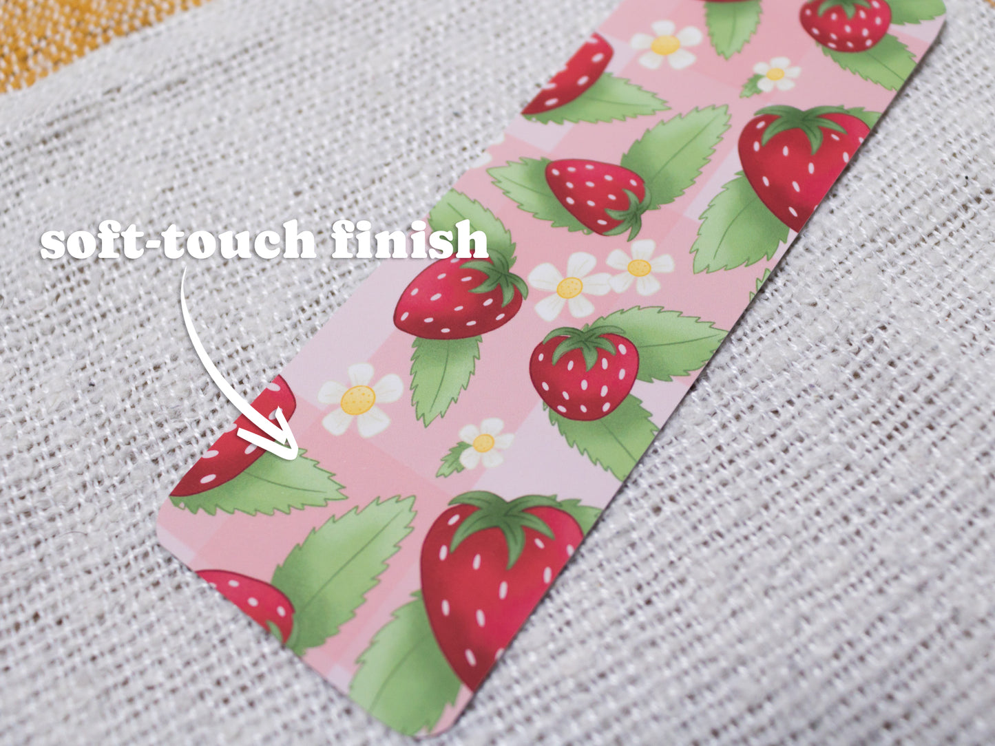 Strawberry Bookmark with Tassel - close up - TEXT OVERLAY: soft-touch finish