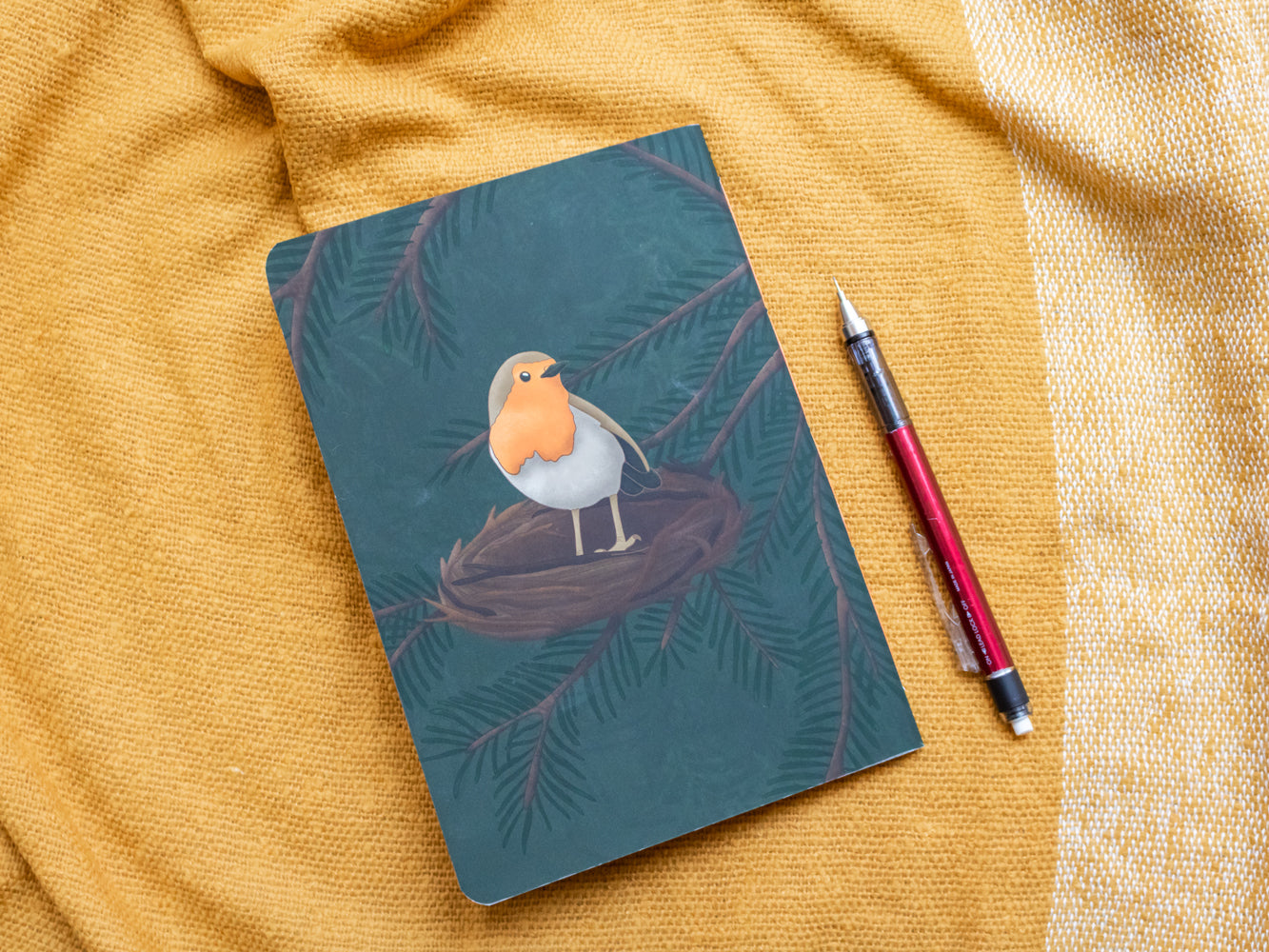 A5 notebook with a robin illustration on a yellow fabric background - back cover
