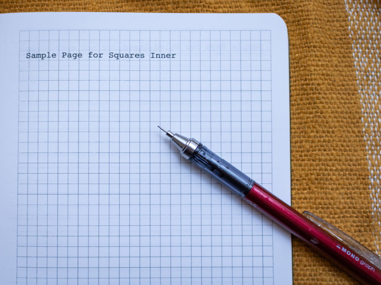 Sample page for square grid inner of A5 notebook with robin illustration