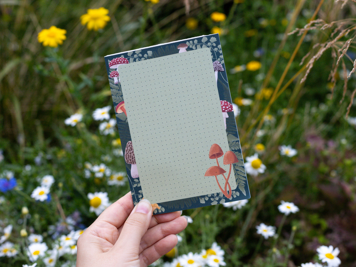 Mushroom and Fern A6 Notepad held in hand