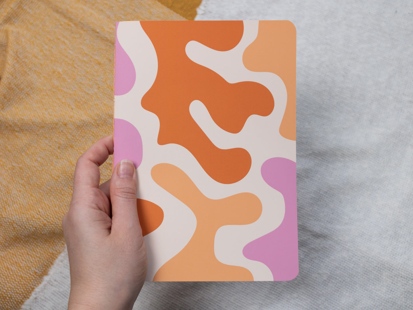 A5 Handmade Notebook with Abstract Design - held in hand