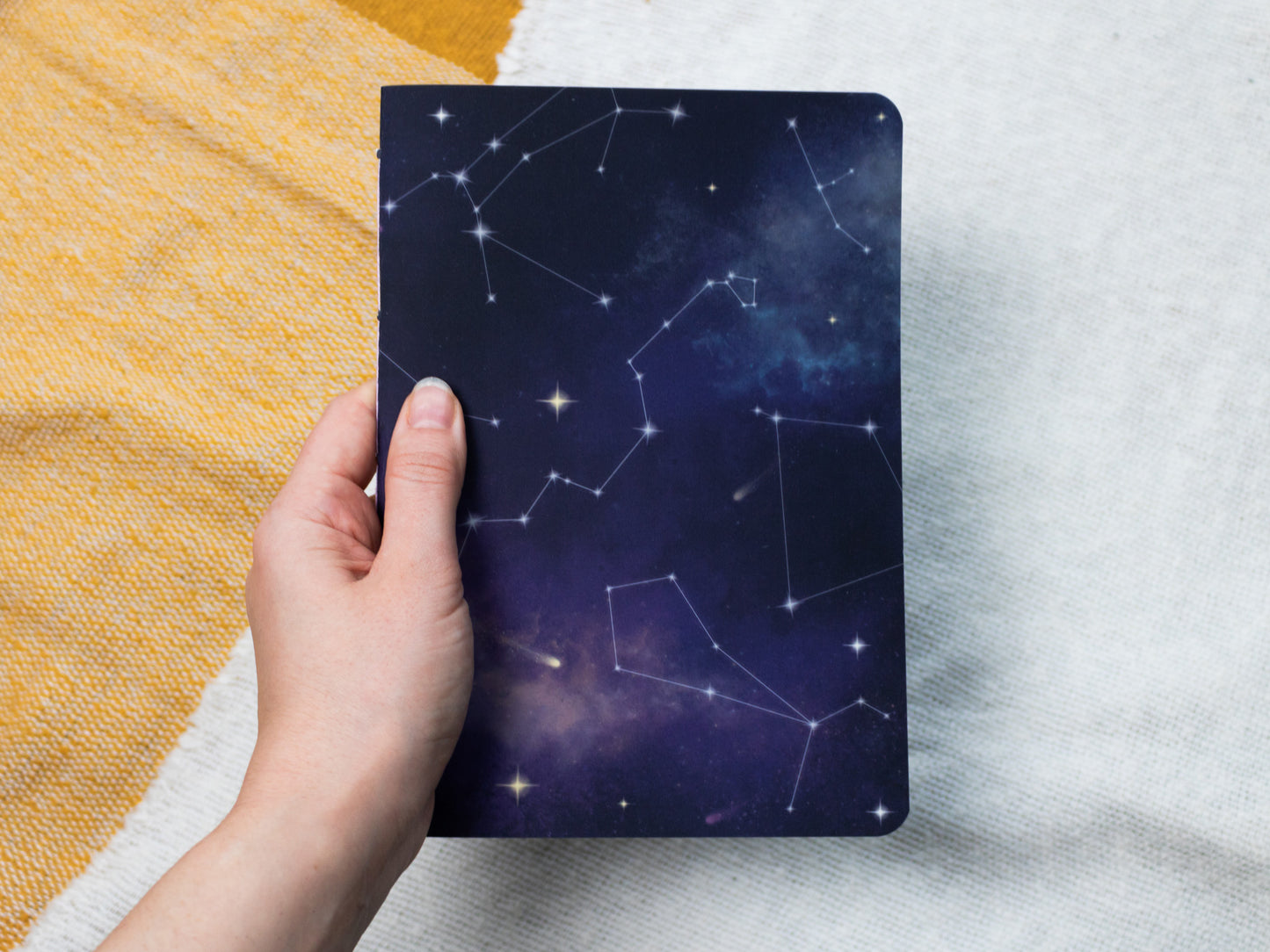 A5 Handmade Notebook with Cosmic Design - held in hand