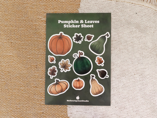 Pumpkin and leaves sticker sheet on a textured fabric background